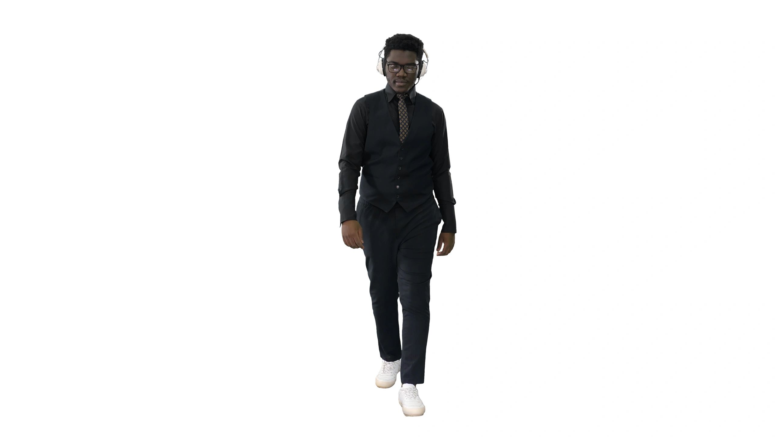 Young african american man listening to music in headphones while walking