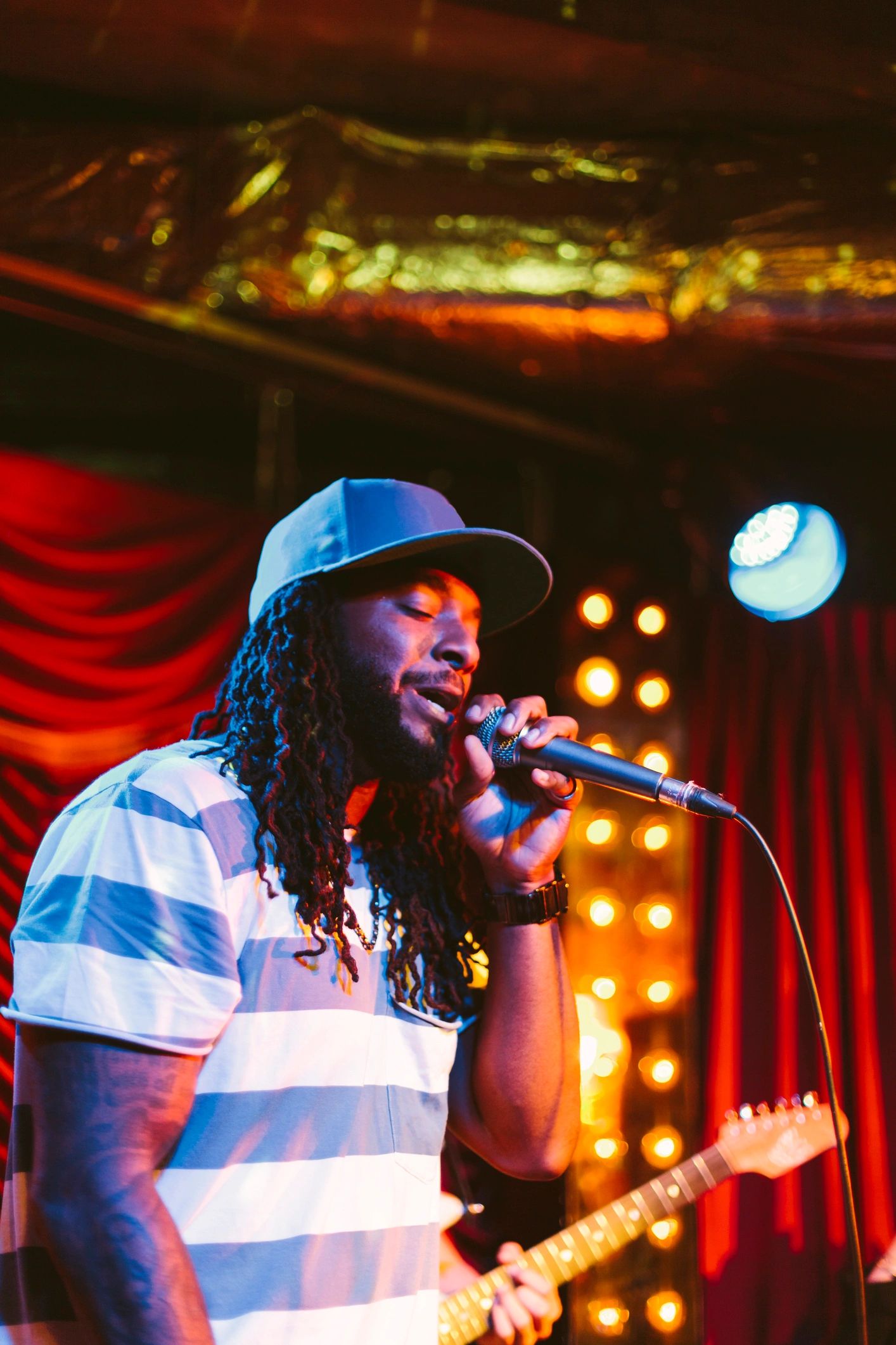 Male singer performing live on stage